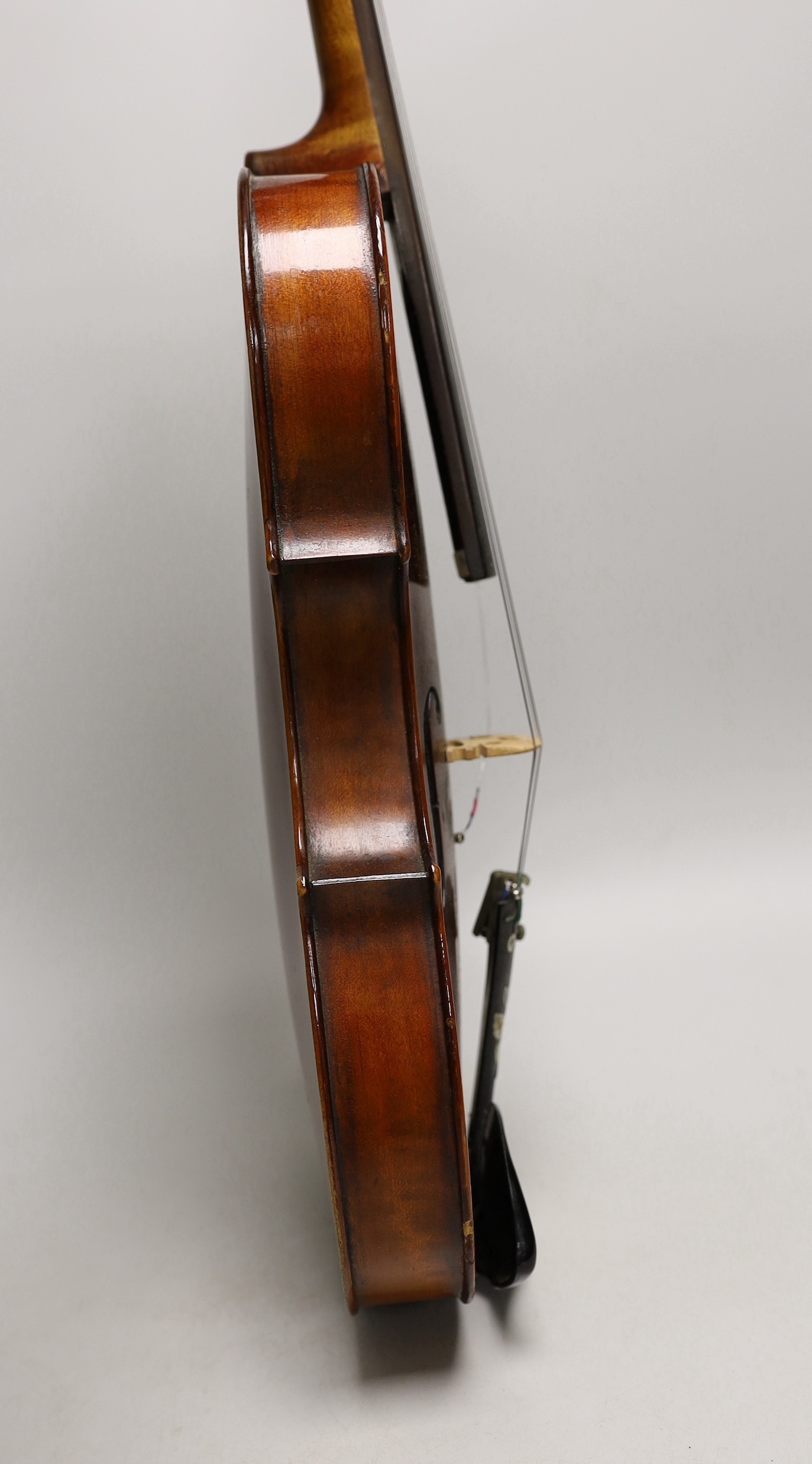 A French single back violin, interior label reads ‘Médio Fino’, back measures 35.5cm excl button. With case and bow